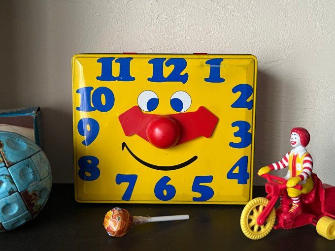 Boite à biscuits en métal avec visage de clown / pendule